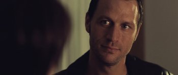 Movie still from “Café de Flore” (2011), directed by Jean-Marc Vallée – A person looking at the camera; Close Up shot, Over the shoulder angle
