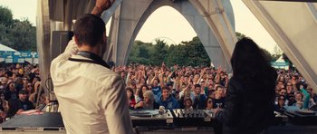 Movie still from “Café de Flore” (2011), directed by Jean-Marc Vallée – A crowd of people sitting in front of an audience; Wide shot, Low angle