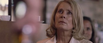 Movie still from “Café de Flore” (2011), directed by Jean-Marc Vallée – An older woman looking up into the air; Close Up shot, Over the shoulder angle