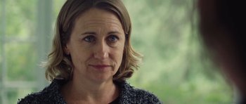 Movie still from “Café de Flore” (2011), directed by Jean-Marc Vallée – A woman's face in front of trees; Close Up shot, Over the shoulder angle
