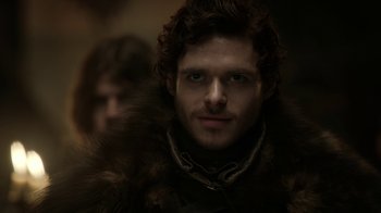 Movie still from “Game of Thrones” (2011), created by D.B. Weiss – A person wearing a fur coat; Close Up shot, Low angle