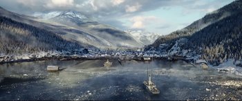 Movie still from “The Call of the Wild” (2020), directed by Chris Sanders – Two boats in a body of water near a mountain; Extreme Wide shot, High angle