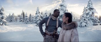 Movie still from “The Call of the Wild” (2020), directed by Chris Sanders – A man and a woman standing next to each other in the snow; Medium shot, Over the shoulder angle