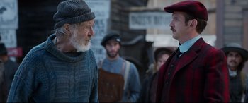 Movie still from “The Call of the Wild” (2020), directed by Chris Sanders – Two men are talking to each other outside; Medium shot, Over the shoulder angle