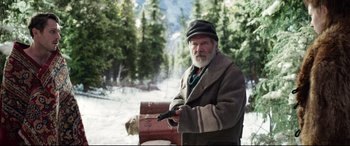 Movie still from “The Call of the Wild” (2020), directed by Chris Sanders – An old man holding a gun in the snow; Medium shot, Low angle