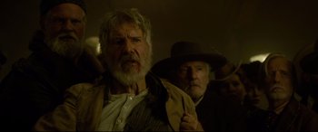 Movie still from “The Call of the Wild” (2020), directed by Chris Sanders – A man with a beard is holding a hat; Close Up shot, Low angle