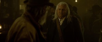 Movie still from “The Call of the Wild” (2020), directed by Chris Sanders – An old man with long white hair and a beard; Close Up shot, Over the shoulder angle