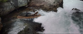 Movie still from “The Call of the Wild” (2020), directed by Chris Sanders – A man and a dog are in a boat in the water; Wide shot, High angle