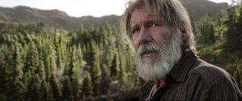 Movie still from “The Call of the Wild” (2020), directed by Chris Sanders – An old man with a beard and a long white beard looking into the distance; Close Up shot, Low angle