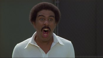 Movie still from “California Suite” (1978), directed by Herbert Ross – A man with a surprised look on his face; Close Up shot, Low angle