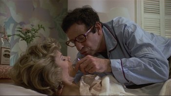 Movie still from “California Suite” (1978), directed by Herbert Ross – A man and a woman are kissing on the bed; Close Up shot, Over the shoulder angle