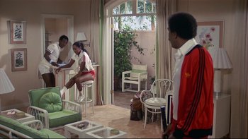 Movie still from “California Suite” (1978), directed by Herbert Ross – A group of people in a living room; Wide shot, High angle