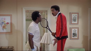 Movie still from “California Suite” (1978), directed by Herbert Ross – Two men are playing tennis in a living room; Medium shot, Low angle