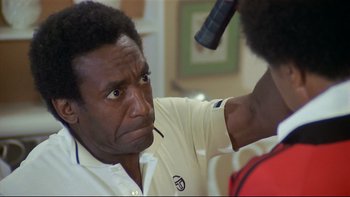 Movie still from “California Suite” (1978), directed by Herbert Ross – An older man is looking into the mirror; Close Up shot, Over the shoulder angle