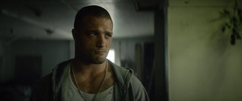 Movie still from “Calm with Horses” (2019), directed by Nick Rowland – A person wearing a hoodie; Close Up shot, Low angle