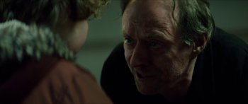 Movie still from “Calm with Horses” (2019), directed by Nick Rowland – A person looking at another person; Close Up shot, Over the shoulder angle