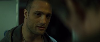 Movie still from “Calm with Horses” (2019), directed by Nick Rowland – A man's face in the dark; Close Up shot, Over the shoulder angle