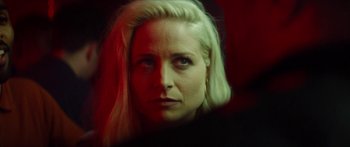 Movie still from “Calm with Horses” (2019), directed by Nick Rowland – A woman with blonde hair stares into the camera; Close Up shot, Over the shoulder angle