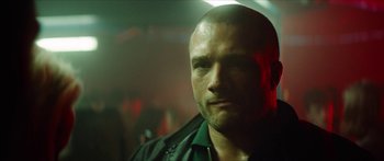 Movie still from “Calm with Horses” (2019), directed by Nick Rowland – A person wearing a black jacket; Close Up shot, Low angle