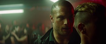 Movie still from “Calm with Horses” (2019), directed by Nick Rowland – A person wearing a black jacket; Close Up shot, Over the shoulder angle