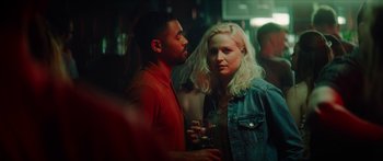 Movie still from “Calm with Horses” (2019), directed by Nick Rowland – A man and a woman standing next to each other in a room; Medium shot, Over the shoulder angle