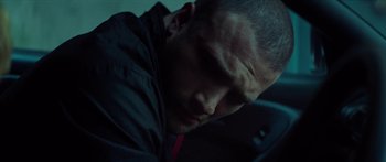 Movie still from “Calm with Horses” (2019), directed by Nick Rowland – A person with his head down; Close Up shot, Low angle