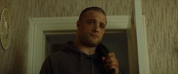 Movie still from “Calm with Horses” (2019), directed by Nick Rowland – A person wearing a hooded sweatshirt; Close Up shot, Low angle