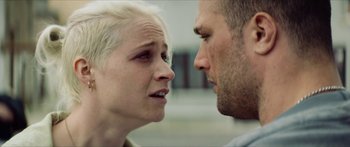Movie still from “Calm with Horses” (2019), directed by Nick Rowland – A man and a woman face to face in front of each other; Close Up shot, Over the shoulder angle
