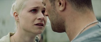 Movie still from “Calm with Horses” (2019), directed by Nick Rowland – A man and a woman face to face in front of each other; Close Up shot, Over the shoulder angle