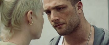 Movie still from “Calm with Horses” (2019), directed by Nick Rowland – A person looking at another person; Close Up shot, Over the shoulder angle