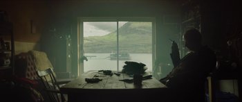 Movie still from “Calm with Horses” (2019), directed by Nick Rowland – A view of a lake from an open window; Extreme Wide shot, Low angle