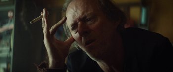 Movie still from “Calm with Horses” (2019), directed by Nick Rowland – An older man with a concerned look on his face; Close Up shot, Over the shoulder angle