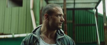 Movie still from “Calm with Horses” (2019), directed by Nick Rowland – A person wearing a jacket; Close Up shot, Low angle