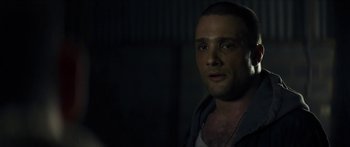 Movie still from “Calm with Horses” (2019), directed by Nick Rowland – A person wearing a jacket; Close Up shot, Over the shoulder angle