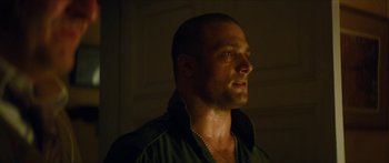 Movie still from “Calm with Horses” (2019), directed by Nick Rowland – A person wearing a green shirt; Close Up shot, Low angle