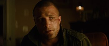 Movie still from “Calm with Horses” (2019), directed by Nick Rowland – A person wearing a jacket; Close Up shot, Over the shoulder angle