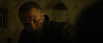 Movie still from “Calm with Horses” (2019), directed by Nick Rowland – A person laying on the ground; Close Up shot, Over the shoulder angle