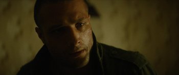 Movie still from “Calm with Horses” (2019), directed by Nick Rowland – A man's face in the dark; Close Up shot, Over the shoulder angle