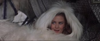 Movie still from “Camelot” (1967), directed by Joshua Logan – A woman in a white feather hat looking at the camera; Close Up shot, High angle