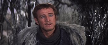 Movie still from “Camelot” (1967), directed by Joshua Logan – A person wearing a fur coat; Close Up shot, Over the shoulder angle