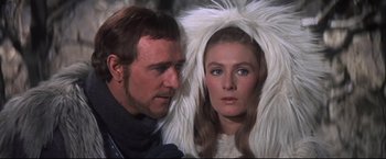 Movie still from “Camelot” (1967), directed by Joshua Logan – A man and a woman wearing white fur; Close Up shot, Over the shoulder angle