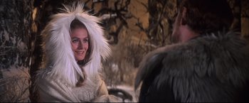 Movie still from “Camelot” (1967), directed by Joshua Logan – A woman in a white fur coat and a man in a white fur coat; Close Up shot, Over the shoulder angle