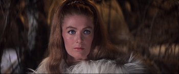 Movie still from “Camelot” (1967), directed by Joshua Logan – A person with long brown hair and blue eyes; Close Up shot, Over the shoulder angle