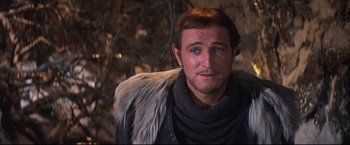 Movie still from “Camelot” (1967), directed by Joshua Logan – A person wearing a fur coat; Close Up shot, Over the shoulder angle