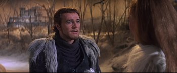 Movie still from “Camelot” (1967), directed by Joshua Logan – A person wearing a costume; Close Up shot, Over the shoulder angle