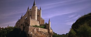 Movie still from “Camelot” (1967), directed by Joshua Logan – A castle like building on top of a hill; Extreme Wide shot, Low angle
