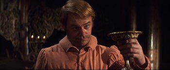 Movie still from “Camelot” (1967), directed by Joshua Logan – A person wearing a shirt; Close Up shot, Low angle