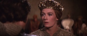 Movie still from “Camelot” (1967), directed by Joshua Logan – A person wearing a crown; Close Up shot, Over the shoulder angle