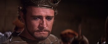 Movie still from “Camelot” (1967), directed by Joshua Logan – A person wearing a crown; Close Up shot, High angle