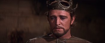 Movie still from “Camelot” (1967), directed by Joshua Logan – A person wearing a crown; Close Up shot, Low angle